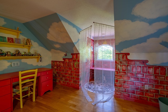78 Lakeview Rd, Glenburn, ME 04401 - bathroom with wood finished floors, vaulted ceiling, and a walk in shower