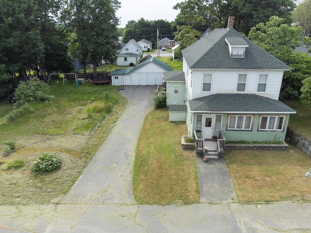 18/20 Beech St, East Millinocket, ME 04430 - view of front of home with roof with shingles, a front lawn, a chimney, an outdoor structure, and view of scattered trees
