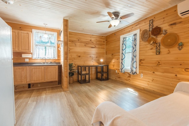 18/20 Beech St, East Millinocket, ME 04430 - bedroom featuring an AC wall unit, light wood-type flooring, freestanding refrigerator, wooden ceiling, and wooden walls