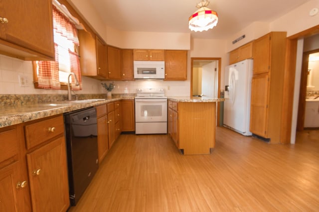 18/20 Beech St, East Millinocket, ME 04430 - kitchen with white appliances, brown cabinets, decorative backsplash, and light wood-type flooring
