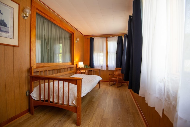 18/20 Beech St, East Millinocket, ME 04430 - bedroom with wood finished floors and wooden walls