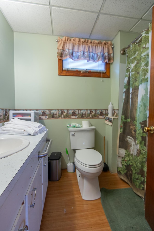 18/20 Beech St, East Millinocket, ME 04430 - bathroom featuring a paneled ceiling, wood finished floors, curtained shower, and vanity