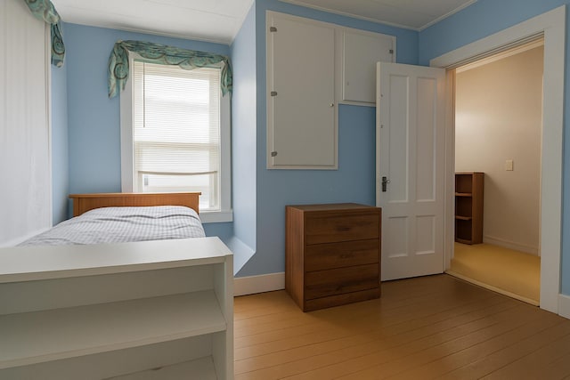 18/20 Beech St, East Millinocket, ME 04430 - bedroom featuring light wood-type flooring, multiple windows, and ornamental molding