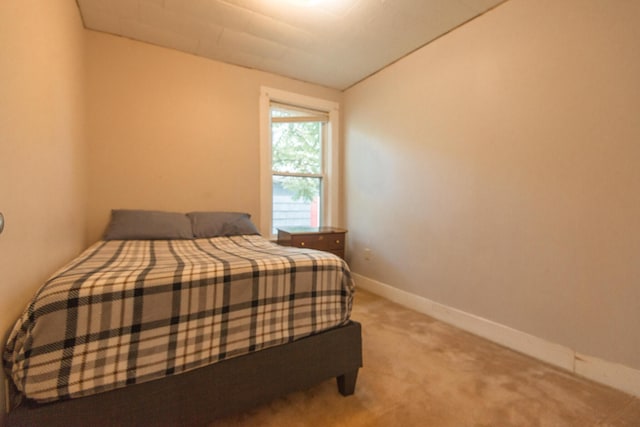 18/20 Beech St, East Millinocket, ME 04430 - bedroom featuring light colored carpet and vaulted ceiling