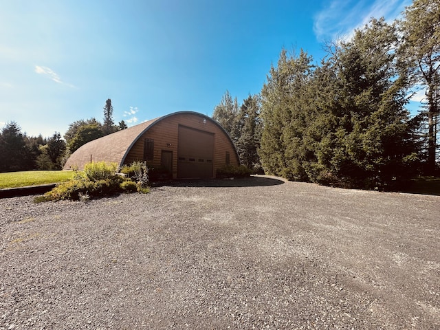 151 Schooland Rd, New Sweden, ME 04762 - view of outdoor structure featuring gravel driveway