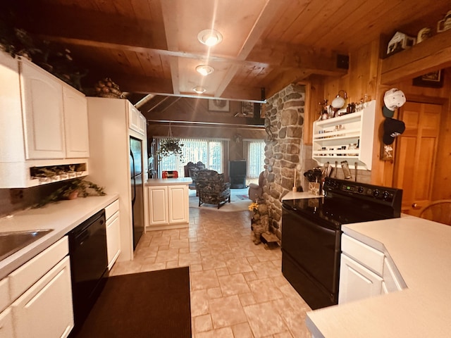 151 Schooland Rd, New Sweden, ME 04762 - kitchen with black appliances, a wooden ceiling with exposed beams, stone tile floors, light countertops, and white cabinets