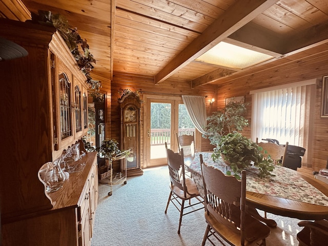 151 Schooland Rd, New Sweden, ME 04762 - carpeted dining room featuring a wood ceiling with exposed beams and wooden walls