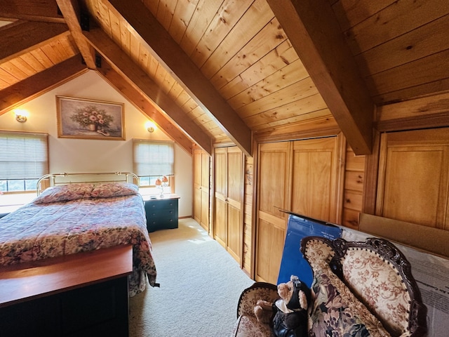 151 Schooland Rd, New Sweden, ME 04762 - bedroom with light colored carpet, wood ceiling, and multiple closets