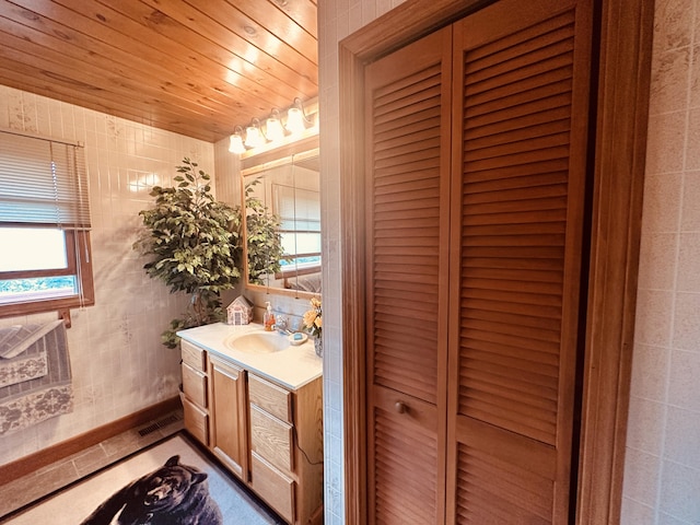 151 Schooland Rd, New Sweden, ME 04762 - bathroom with vanity and wood ceiling