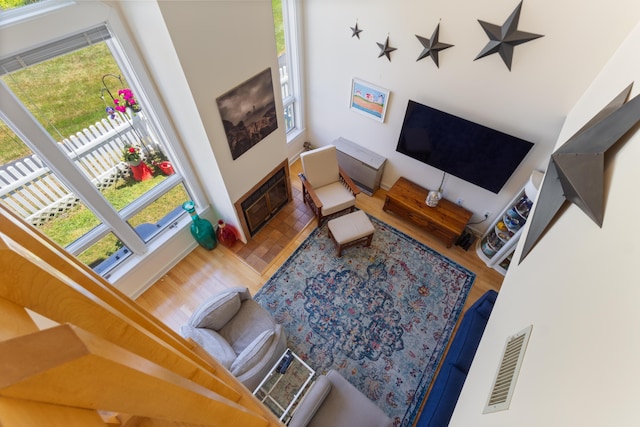 36 Ocean House Way Unit E4, York, ME 03909 - living room with healthy amount of natural light, wood finished floors, and a high ceiling