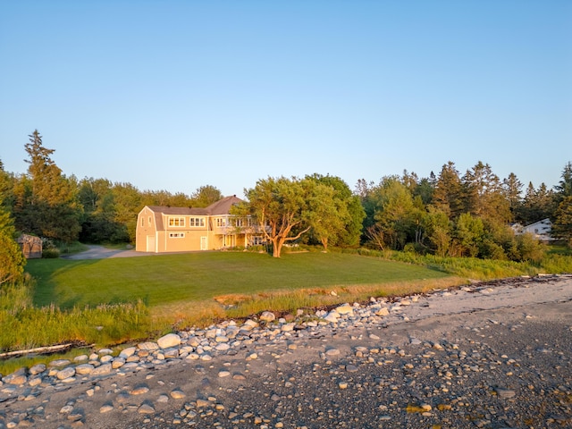 48 Sheltons Rd, Trenton, ME 04605 - view of front facade with a front yard and a wooded view