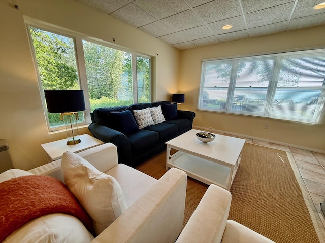 48 Sheltons Rd, Trenton, ME 04605 - living room with a paneled ceiling and tile patterned floors