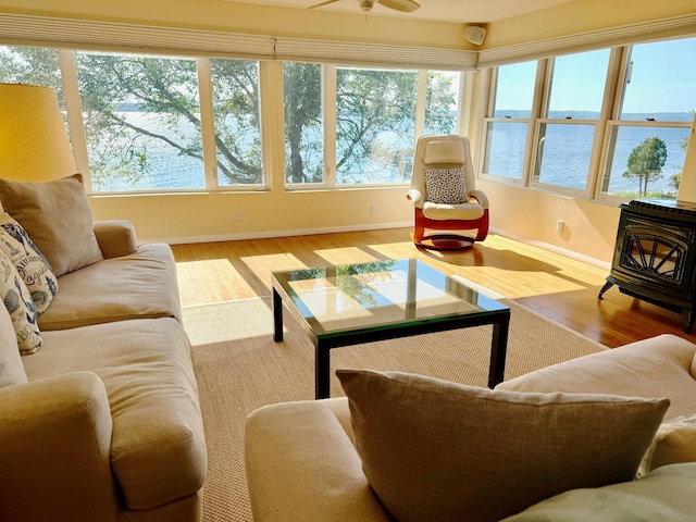 48 Sheltons Rd, Trenton, ME 04605 - living area featuring healthy amount of natural light, a wood stove, and wood finished floors
