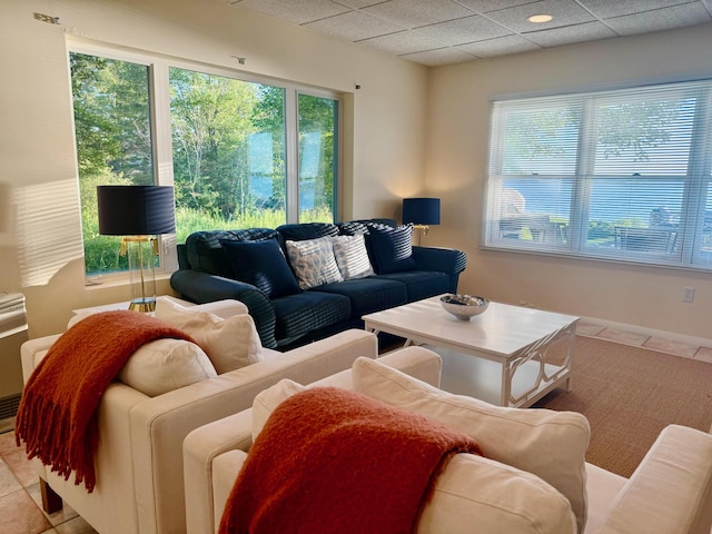 48 Sheltons Rd, Trenton, ME 04605 - living area with light tile patterned floors and a drop ceiling