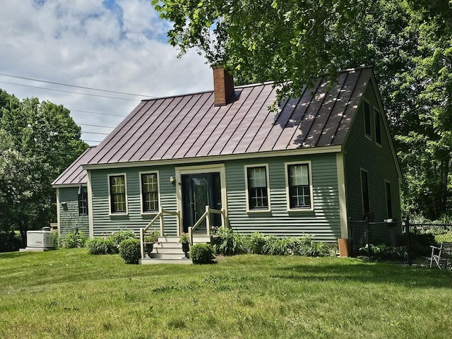 8 Longfellow School Rd, Bristol, ME 04539 - view of front of home with a standing seam roof, a chimney, and a metal roof