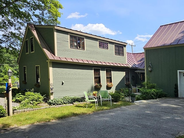8 Longfellow School Rd, Bristol, ME 04539 - view of front of home featuring a metal roof, a standing seam roof, and driveway
