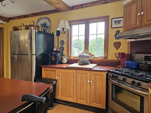 8 Longfellow School Rd, Bristol, ME 04539 - kitchen with appliances with stainless steel finishes, under cabinet range hood, light wood-style floors, and beam ceiling