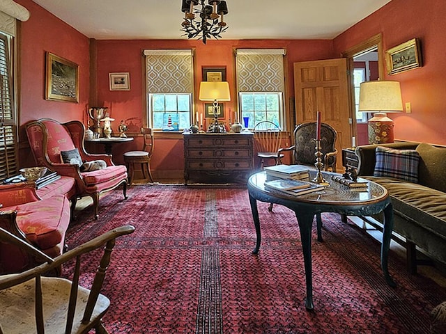 8 Longfellow School Rd, Bristol, ME 04539 - living area with healthy amount of natural light, carpet, and a chandelier