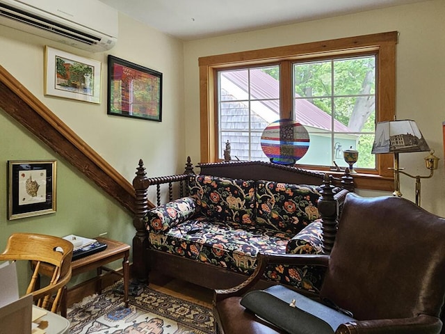 8 Longfellow School Rd, Bristol, ME 04539 - living area featuring a wall mounted AC, plenty of natural light, and wood finished floors