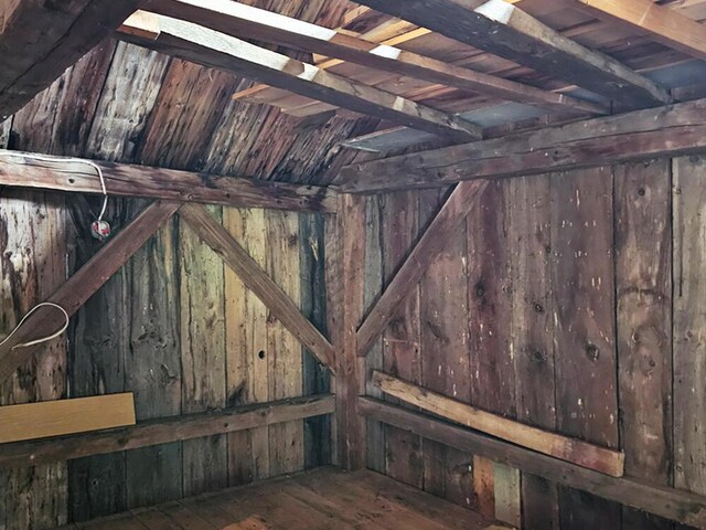8 Longfellow School Rd, Bristol, ME 04539 - detailed view of wood walls, a wood ceiling with exposed beams, and wood finished floors