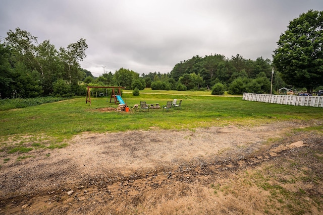 7 Dakin Rd, Turner, ME 04282 - view of grassy yard featuring a playground and an outdoor fire pit