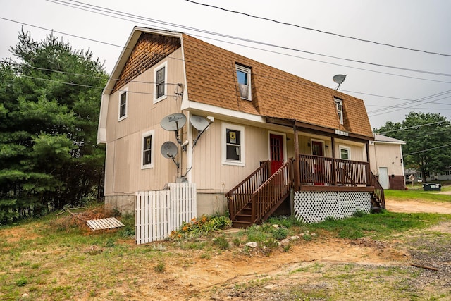7 Dakin Rd, Turner, ME 04282 - view of front of home featuring roof with shingles, covered porch, and stairway