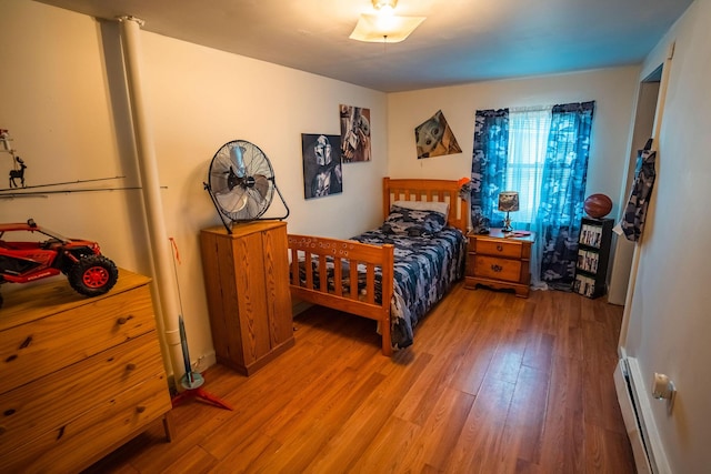 7 Dakin Rd, Turner, ME 04282 - bedroom with a baseboard heating unit and light wood-style flooring
