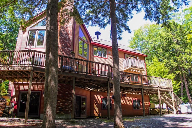 42 Knowles Point Rd, Bridgton, ME 04009 - back of property with a wooden deck and stairway