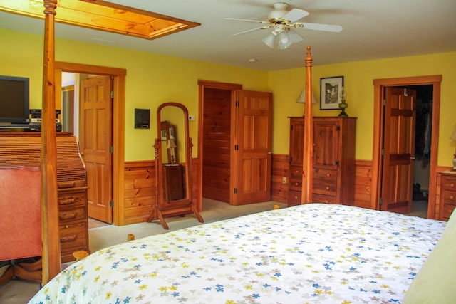 42 Knowles Point Rd, Bridgton, ME 04009 - carpeted bedroom with attic access, wainscoting, wood walls, and ceiling fan