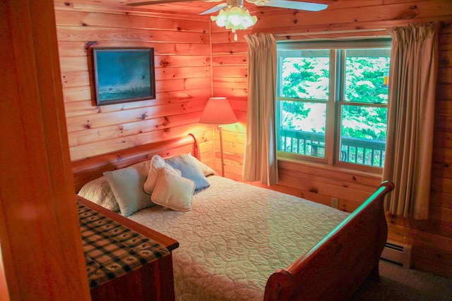 42 Knowles Point Rd, Bridgton, ME 04009 - bedroom with wooden walls, baseboard heating, and a ceiling fan