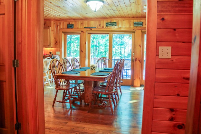 42 Knowles Point Rd, Bridgton, ME 04009 - dining area featuring wooden ceiling, plenty of natural light, wooden walls, and wood finished floors