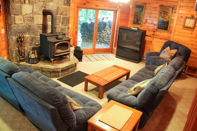42 Knowles Point Rd, Bridgton, ME 04009 - living area with carpet floors, wood walls, and a wood stove
