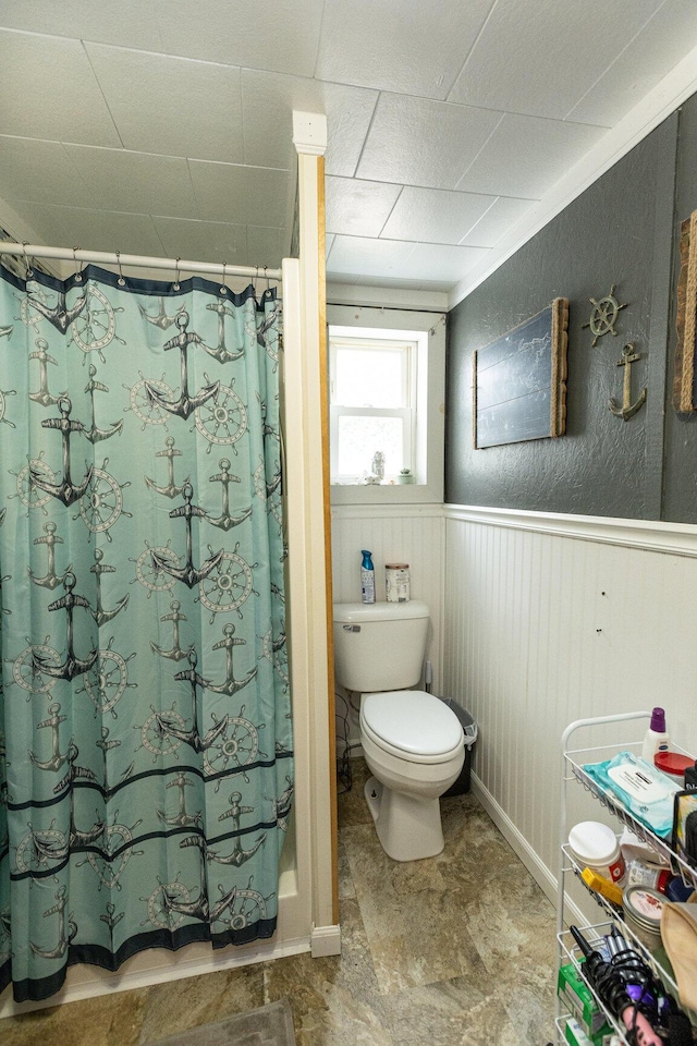 143 Mayfield Rd, Moscow, ME 04920 - bathroom with wainscoting and a shower with curtain