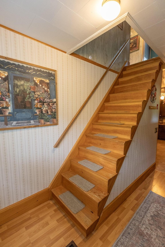 143 Mayfield Rd, Moscow, ME 04920 - staircase featuring wood finished floors and wallpapered walls