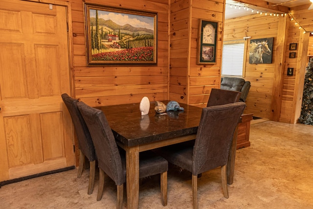 143 Mayfield Rd, Moscow, ME 04920 - dining space featuring wooden walls and light colored carpet