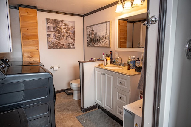 143 Mayfield Rd, Moscow, ME 04920 - bathroom featuring washer / clothes dryer, vanity, and crown molding