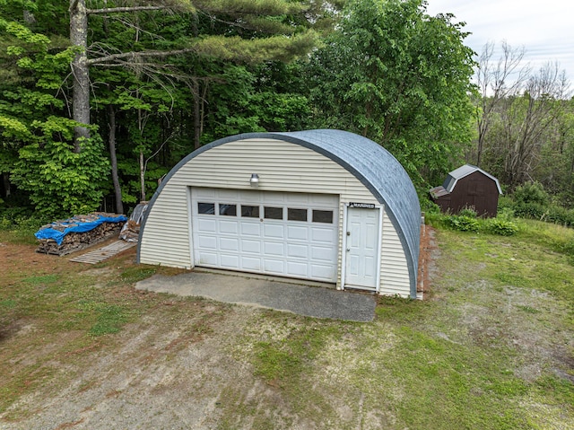 143 Mayfield Rd, Moscow, ME 04920 - detached garage featuring dirt driveway