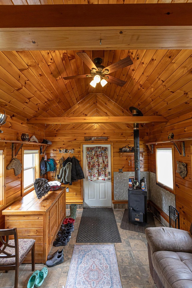 143 Mayfield Rd, Moscow, ME 04920 - living room featuring vaulted ceiling, wood walls, a ceiling fan, and wooden ceiling