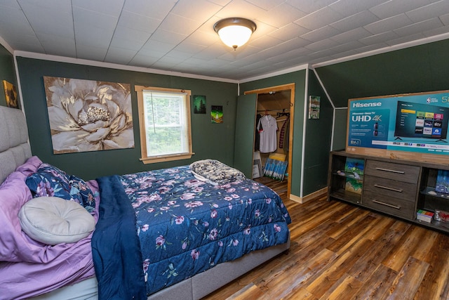 143 Mayfield Rd, Moscow, ME 04920 - bedroom featuring crown molding, wood finished floors, and a closet