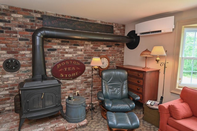 337 Copeland Hill Rd, Holden, ME 04429 - living area with a wall unit AC and a wood stove