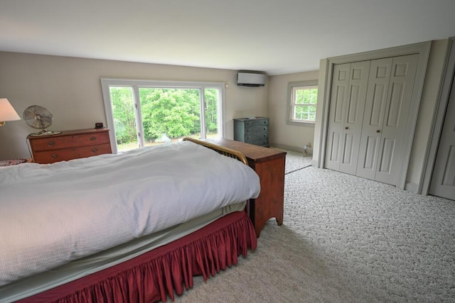 337 Copeland Hill Rd, Holden, ME 04429 - carpeted bedroom with a wall mounted AC and a closet