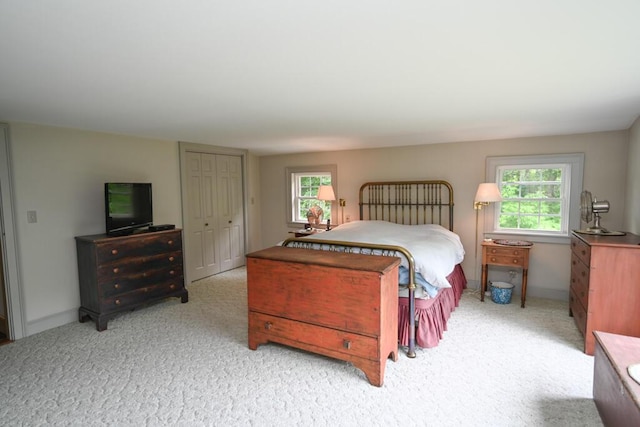 337 Copeland Hill Rd, Holden, ME 04429 - carpeted bedroom with multiple windows and a closet