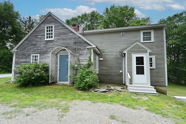 337 Copeland Hill Rd, Holden, ME 04429 - view of front facade with entry steps and a chimney