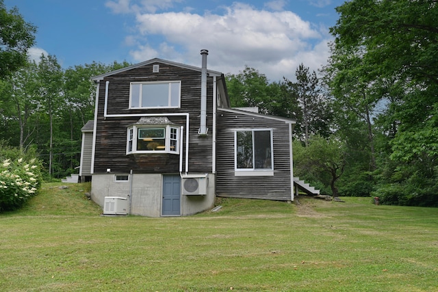 337 Copeland Hill Rd, Holden, ME 04429 - rear view of property with a lawn and stairs