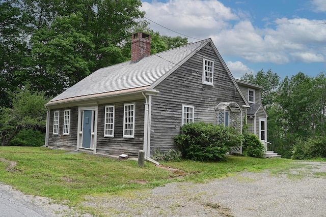 337 Copeland Hill Rd, Holden, ME 04429 - view of front facade with a chimney and a front lawn