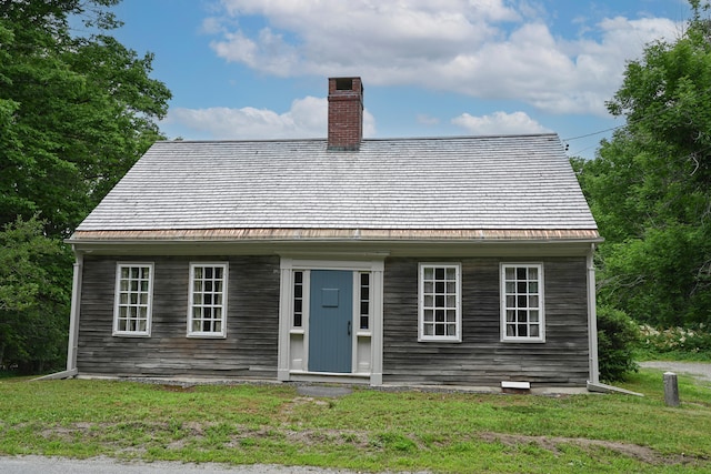 337 Copeland Hill Rd, Holden, ME 04429 - cape cod house featuring a chimney and a front lawn