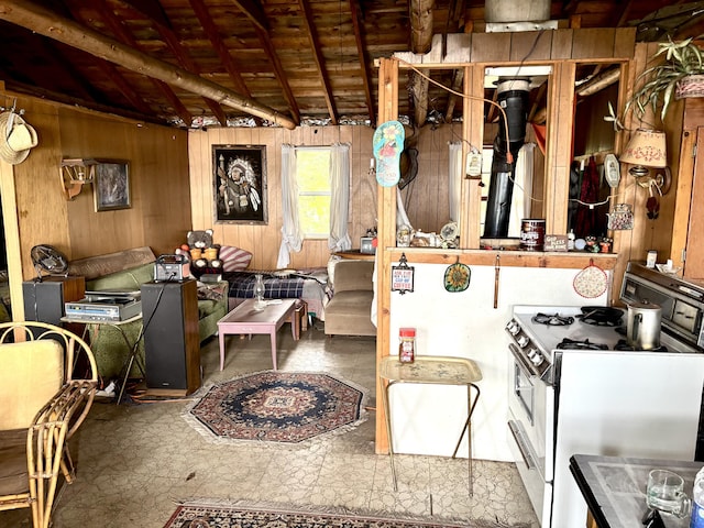 PE021 01 Unit T1 R8, Wels, ME 04462 - kitchen featuring white gas range oven, wood walls, and a wood ceiling with exposed beams