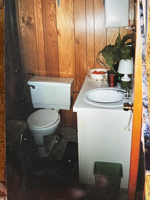 PE021 01 Unit T1 R8, Wels, ME 04462 - bathroom featuring vanity and wood walls