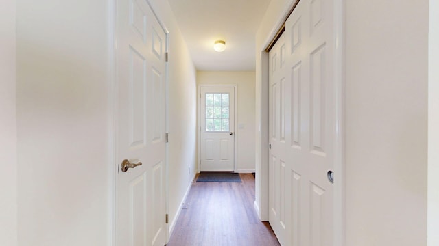 452 Flat Rd, Bethel, ME 04217 - hall featuring dark wood-style flooring and baseboards