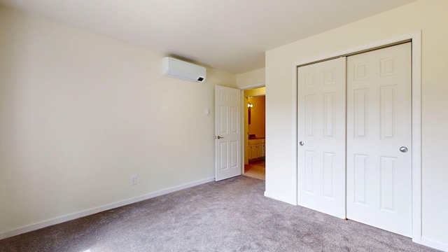 452 Flat Rd, Bethel, ME 04217 - unfurnished bedroom featuring an AC wall unit, carpet floors, and a closet